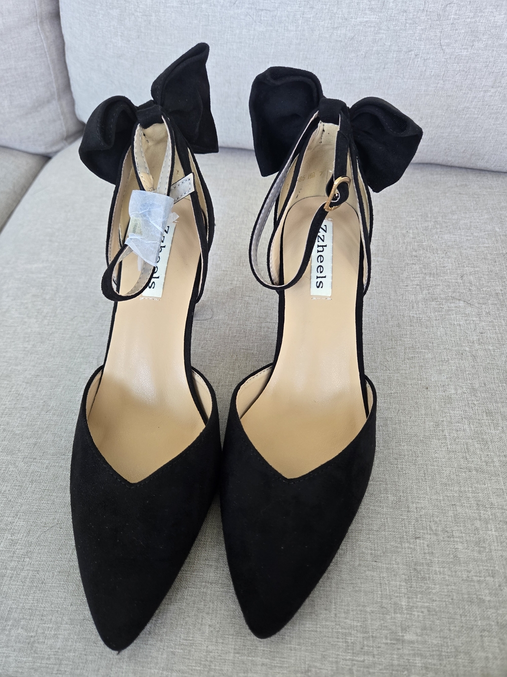 Bow-Back Pointed Ankle-Strap Heels in Black